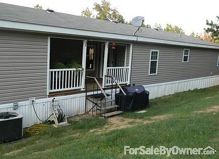 Outside Back
						:
						showing covered back deck and A/C unit