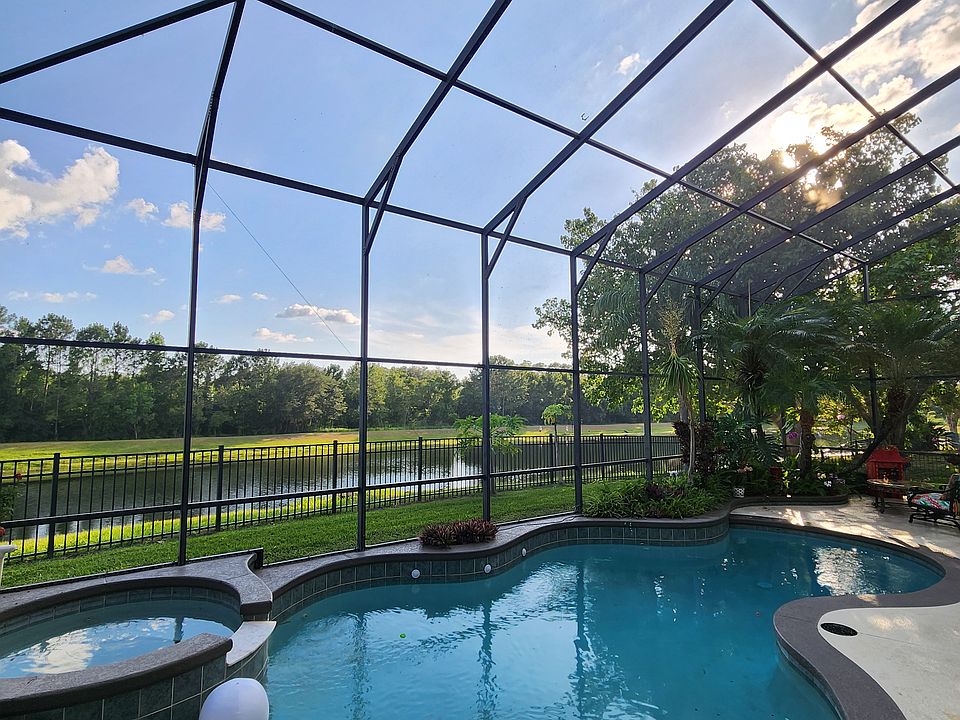 Pool and hot tub overlooking pond and conservation lot.