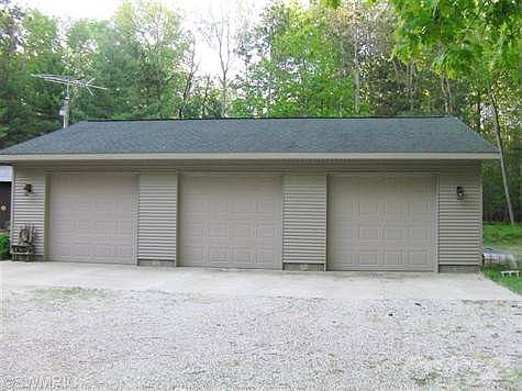 Garage is 32 X 40, insulated, epoxy floor, a drive through bay for ease of pulling a boat in, an attic for storage that also has a power hoist to hoist heavy items up to the attic.