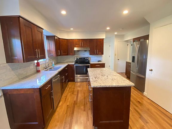 kitchen with oak cabinet and granite countertop