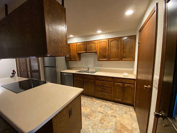 Kitchen with pantry taken from carport entry.