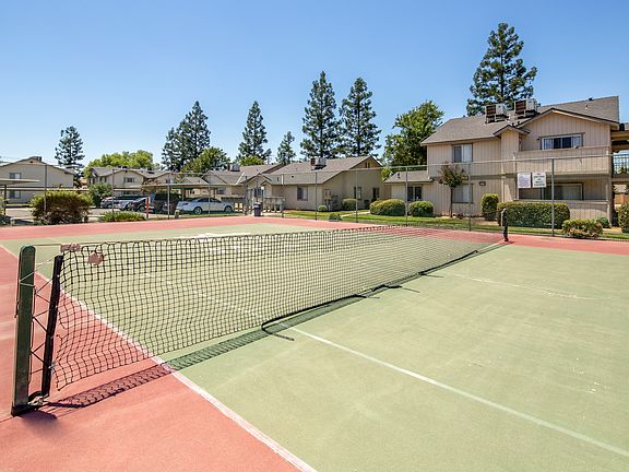 Tennis court in the meddle of the complex.