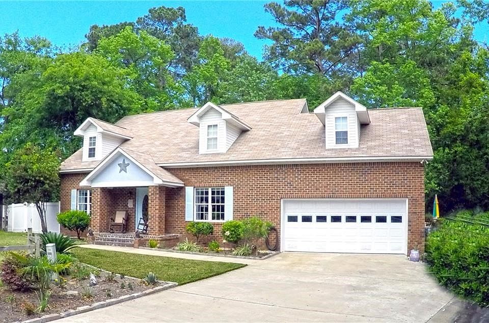 Large brick home on a private fenced lot with new interior renovations.