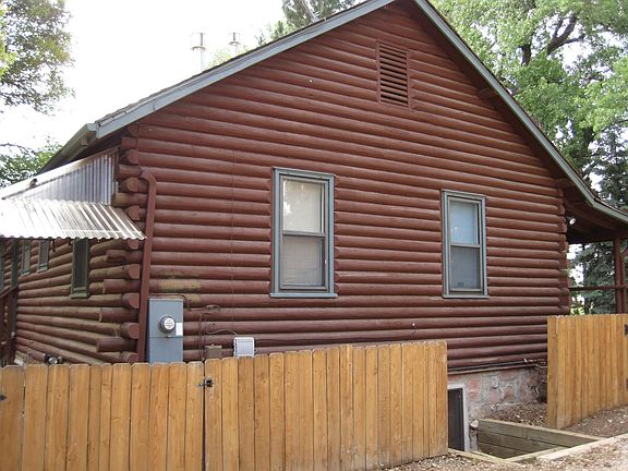 Side gate entrance from driveway to rear of house/basement entrance.
