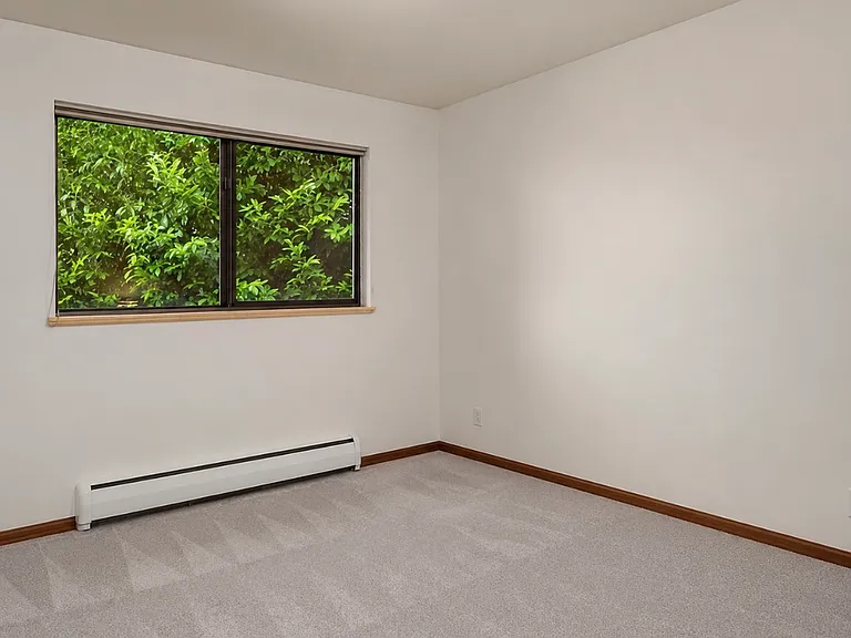 Third bedroom on main level with closet out of frame will be unfurnished. (Currently used as an office.)