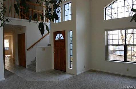 This custom home offers tons of windows and dramatic ceilings.