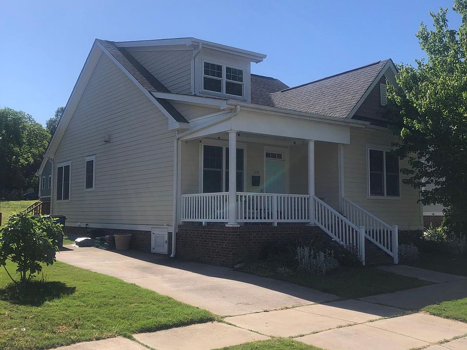 Driveway has space for 2 cars. House is west-facing, meaning front porch is shaded in the morning and sunny in the afternoon. Lots of flowers in the front garden.