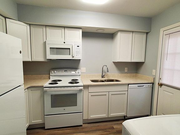 Kitchen with new cabinets, granite countertops, and appliances.