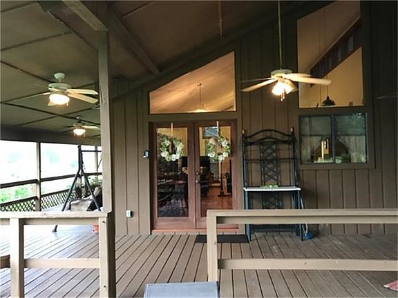 Covered entrance way and attached carport