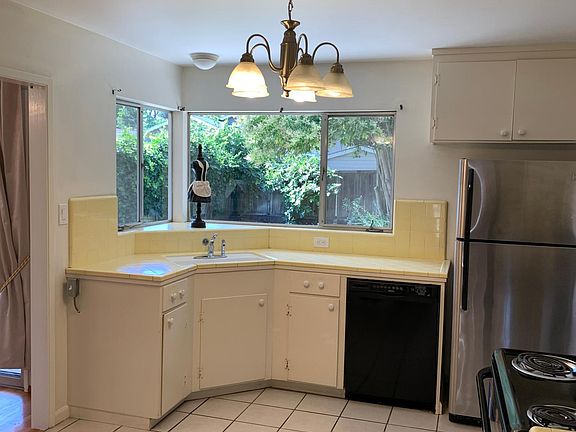 Bright spacious kitchen overlooking large backyard.