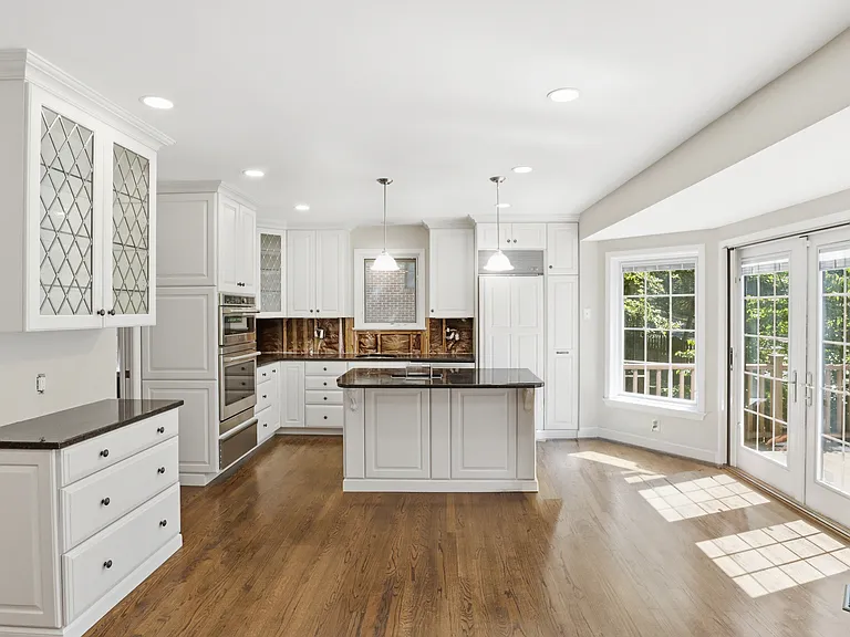 View from Family Room to Kitchen and French Doors to Deck