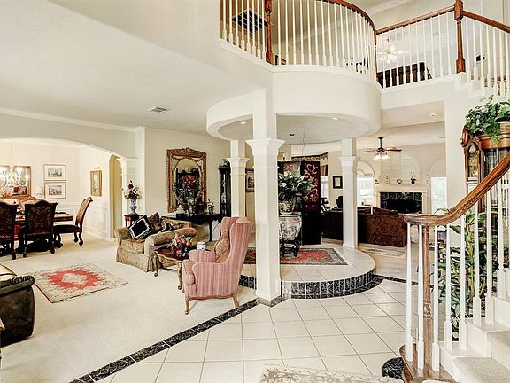 Formal living and dining overlook the pedestal area perfect for that baby grand!