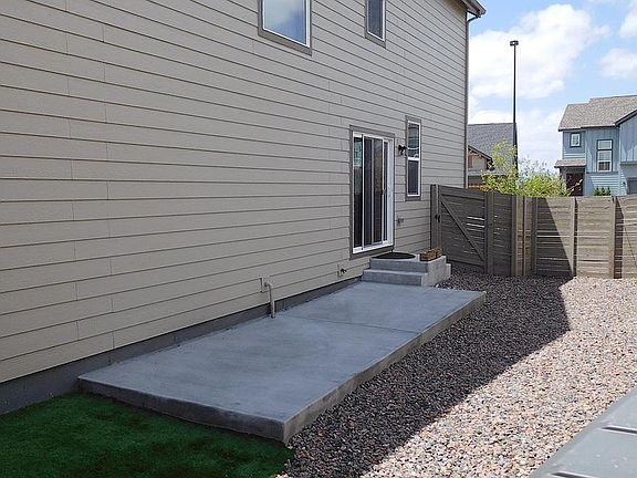 Patio and Artificial Grass for Low Maintenance. Pocket park 500 ft behind garage.