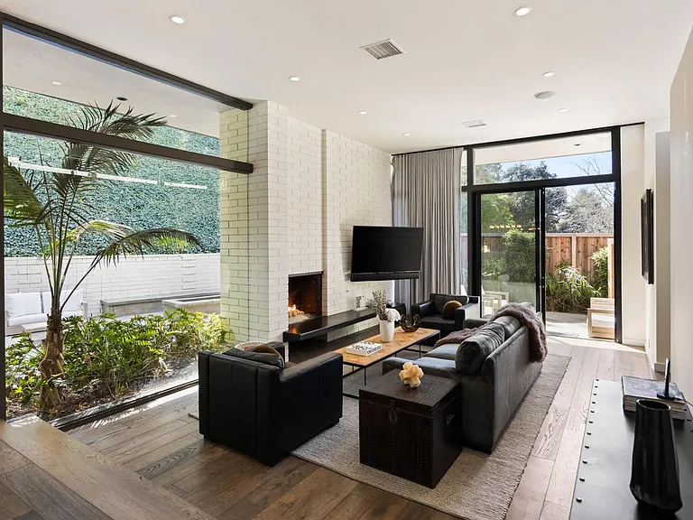 Relax in the spacious living room adorned with stylish decor and comfy furnishings, perfect for entertaining.