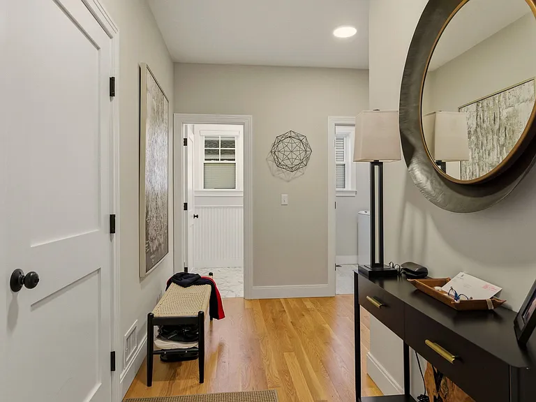 back hallway with laundry and 1/2 bath