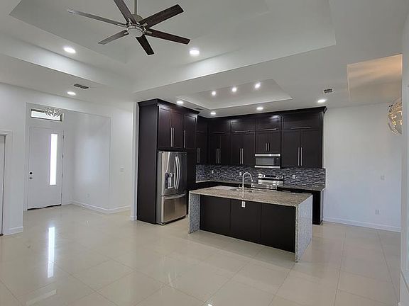5th image of 9312 N Queen Palm
