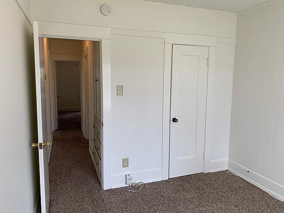 Bedroom #1 and Hallway with Linen Cupboards