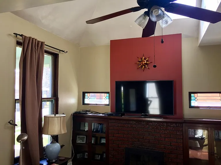 Working fireplace, vaulted ceilings with sky lights and origianl charm, built-ins and stained glass windows.