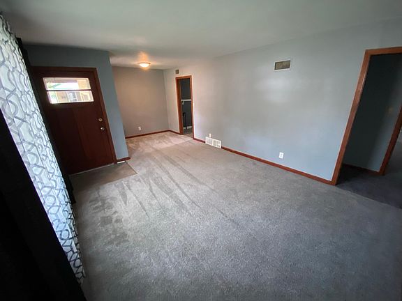 New carpet in living room within dining nook.