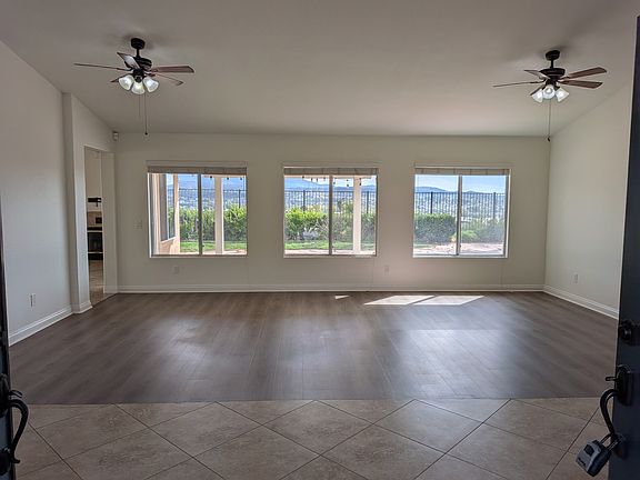 Dining Room / Living Room from the front door. The three (3) back windows have view of Mt Palomar.