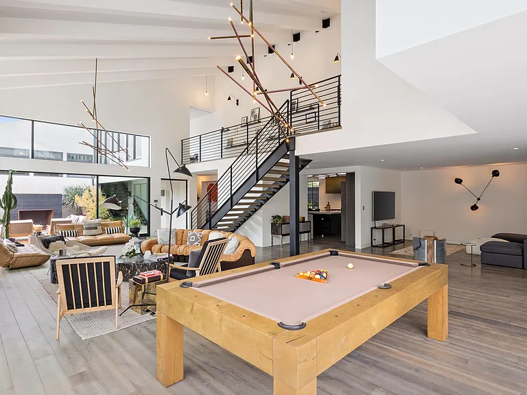 The pool table is situated to allow a fresh breeze to flow as you play.