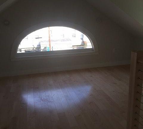 top floor w. half moon window