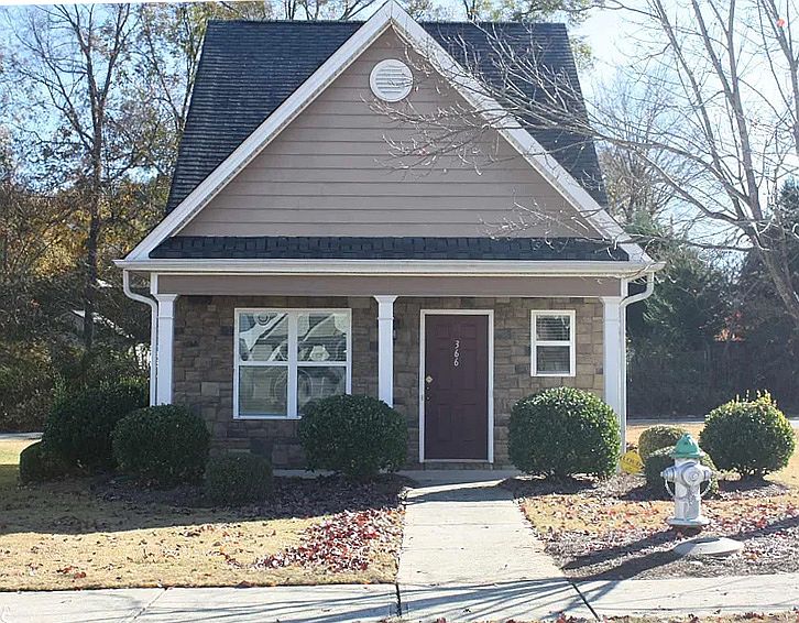 Outside of house. Nice quiet neighborhood with sidewalks and public transit. Security cameras at exterior doors.