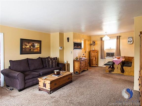 Living Room and dining area with newer carpet and nicely painted