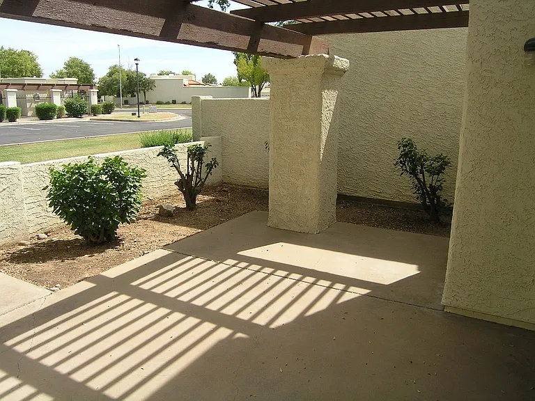 Covered patio opens to green belt