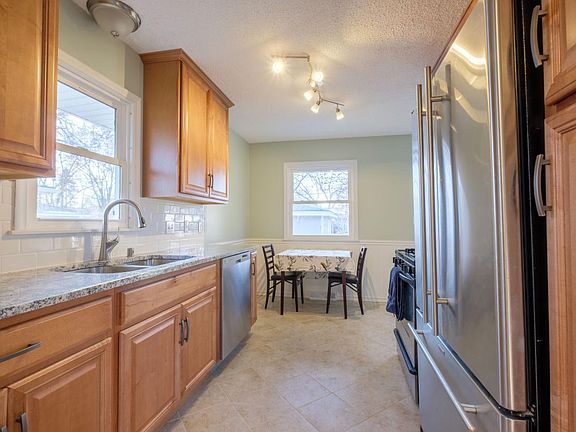Kitchen features beautiful granite and stainless appliances