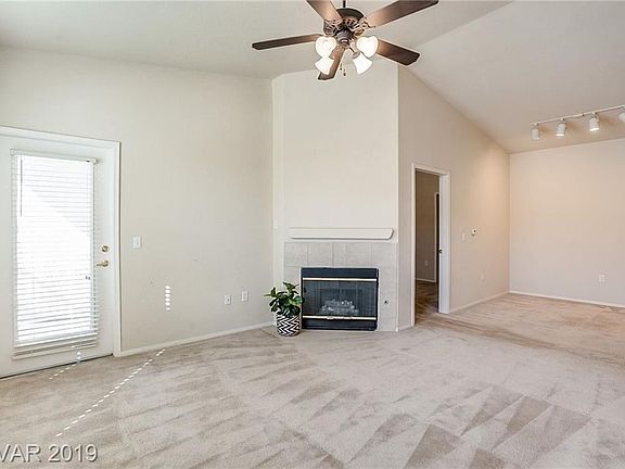 *The Living Room and Dining areas feature a fireplace,track lighting, and a cozy balcony.