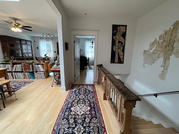 New maple floors and stairs with custom historic railings.