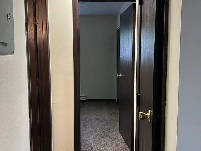 hallway with closet (going to first bedroom and bathroom)