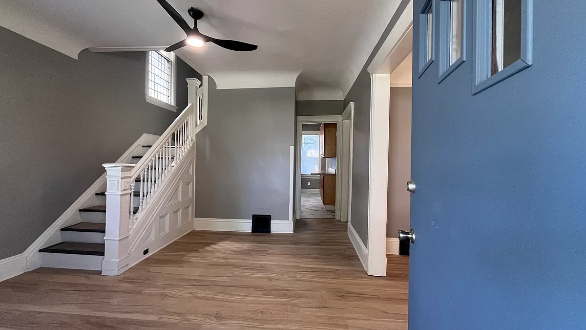 Entrance Foyer showcasing tasteful design and laminate wood plank floors. - 2366 E 85th St