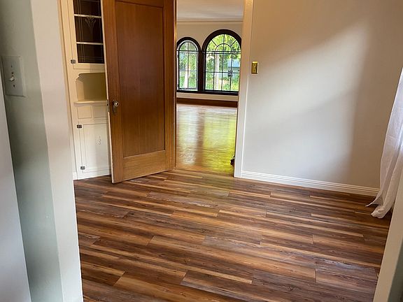 View of Dining Room from kitchen. Two sets of build in cabinets.