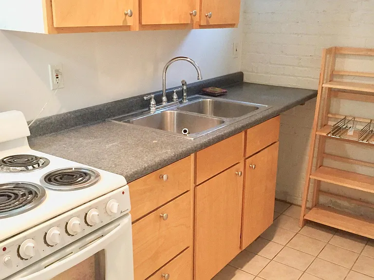 Lower level in-law suite features full 2nd kitchen.