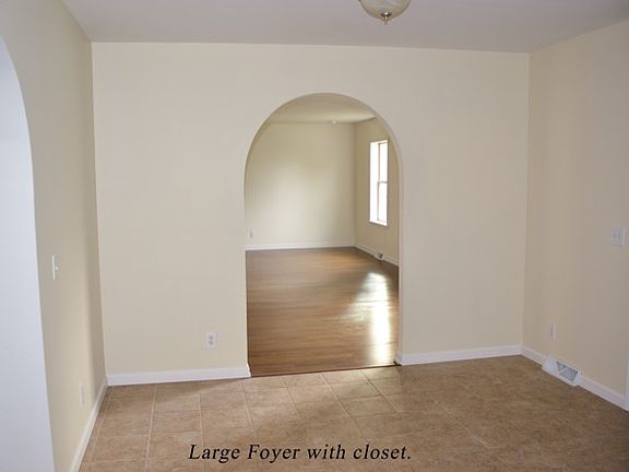 Foyer with coat closet.