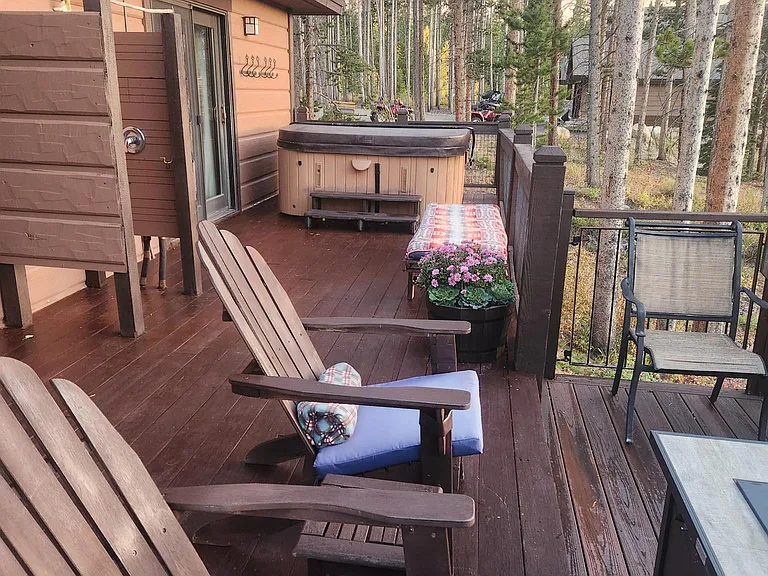 Furnished deck with hot tub and outdoor shower