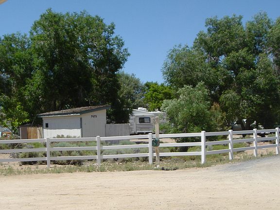 the mailbox and 3 rail fence