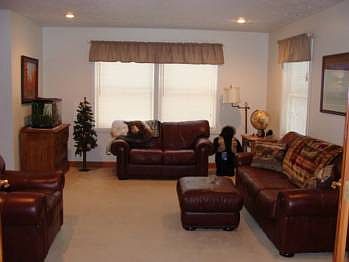 Living room has french doors between the sitting area and the living room.