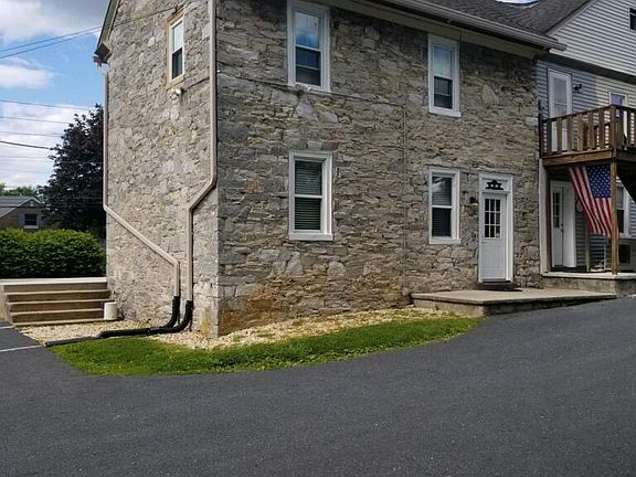 Entrance is in the back of building