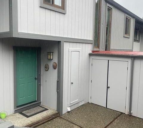 Patio entrence with outside cabinit storage.