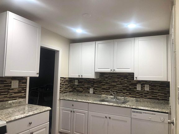 Fully remodeled Kitchen with backsplash and recess lights. Access to Breakfast room from kitchen