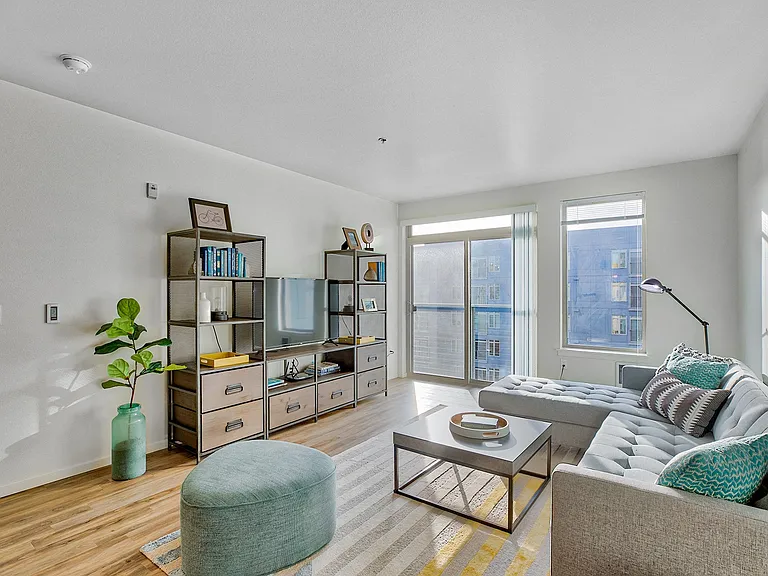 Large living room with floor to ceiling windows