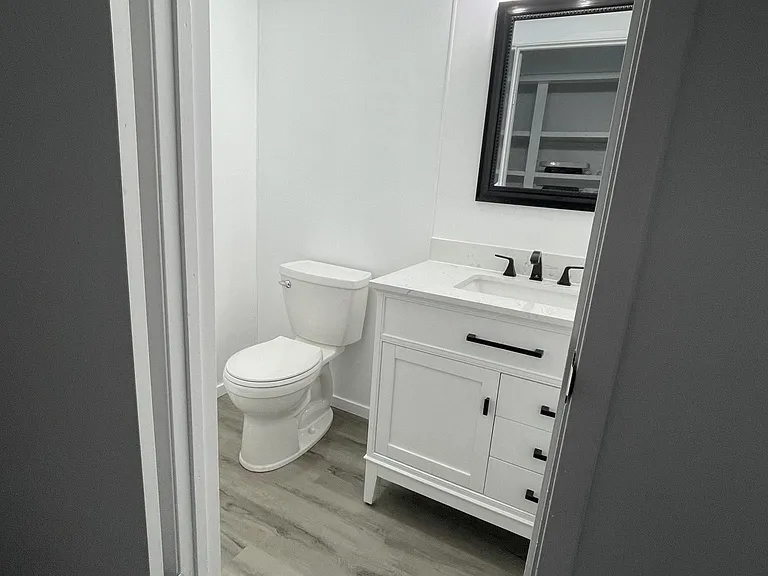 Clean and refreshed bathrooms, including a convenient half-bath.