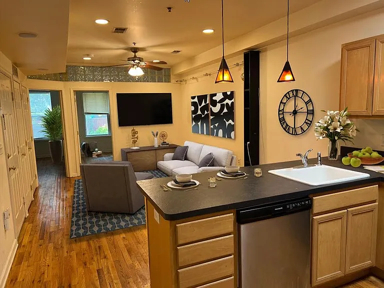 Open style living room with breakfast bar kitchen.