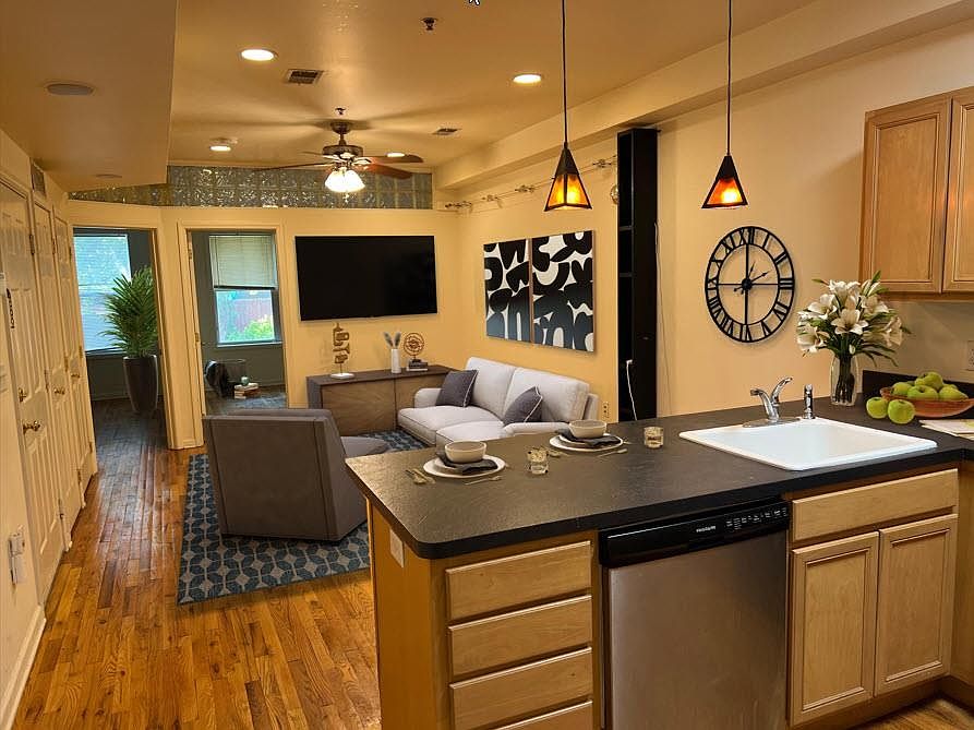 Open style living room with breakfast bar kitchen.