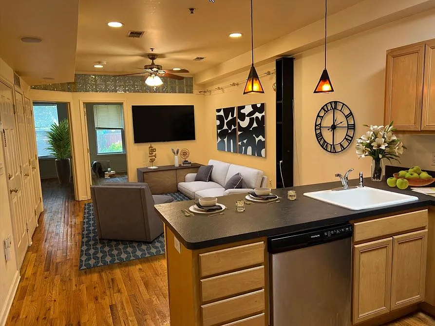 Open style living room with breakfast bar kitchen.