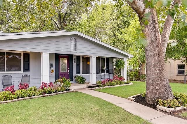 Welcome to Old Georgetown. Nestled under towering trees, this single story awaits its new owners.