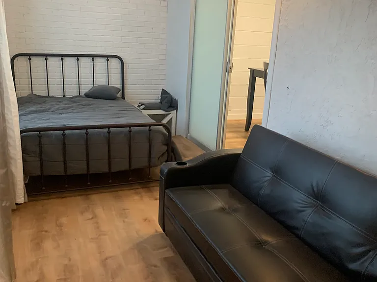 2nd bedroom with full bed and full futon couch/bed with intable and dresser